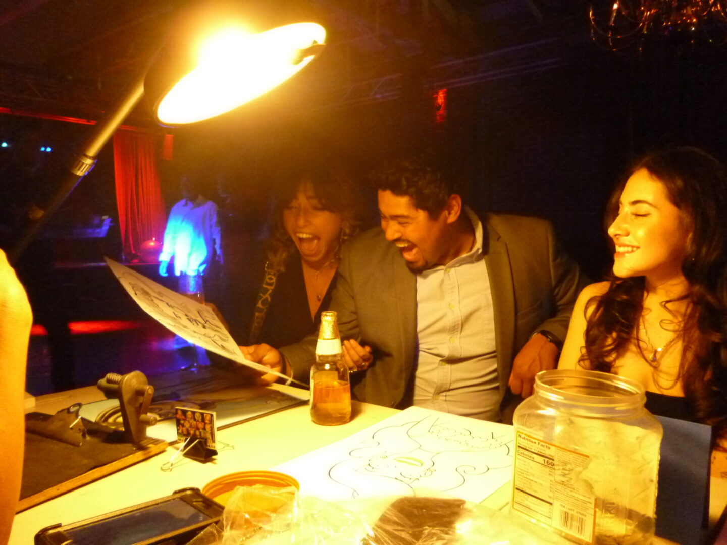 Friends laughing at a table
