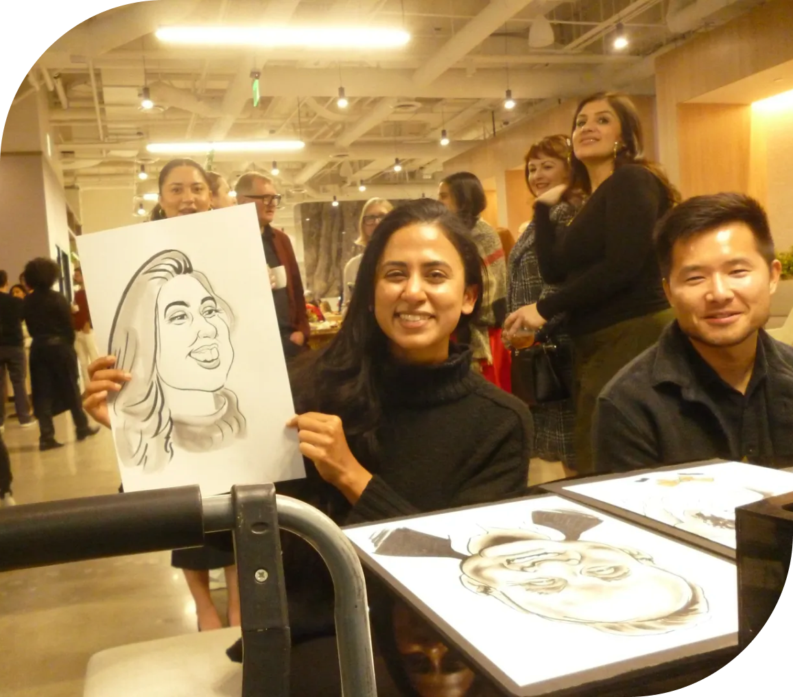 Smiling woman displays her caricature drawing
